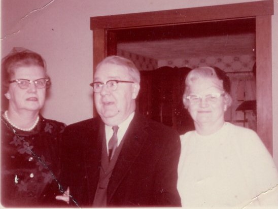 3 people in doorway